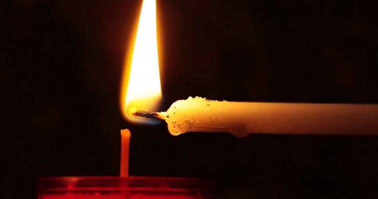 Why lighting up a candle in church?