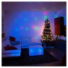 Christmas laser lights projector blue with Christmas decorations for interiors