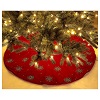 Red Christmas tree skirt with fireworks. 130 c polyester and rayon