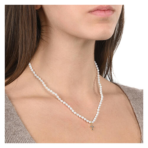 Benedictus necklace of white pearls, cross with blue rhinestones